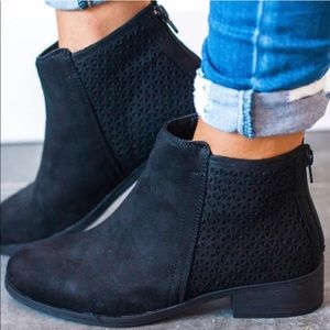Black ankle booties, geometric cutout detail